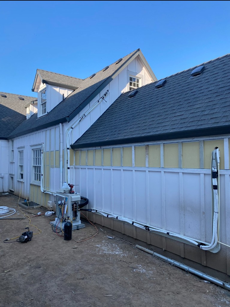 Line set covers along the side of a building