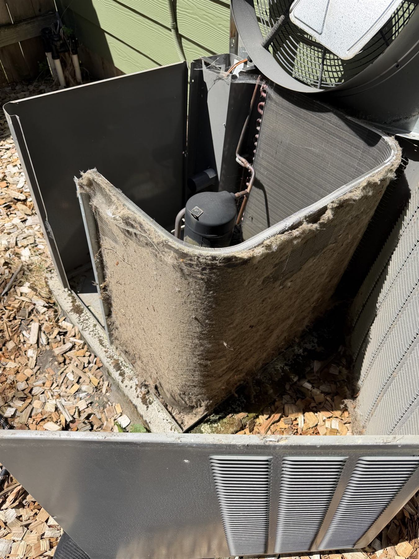 A dirty outdoor coil opened during a service visit