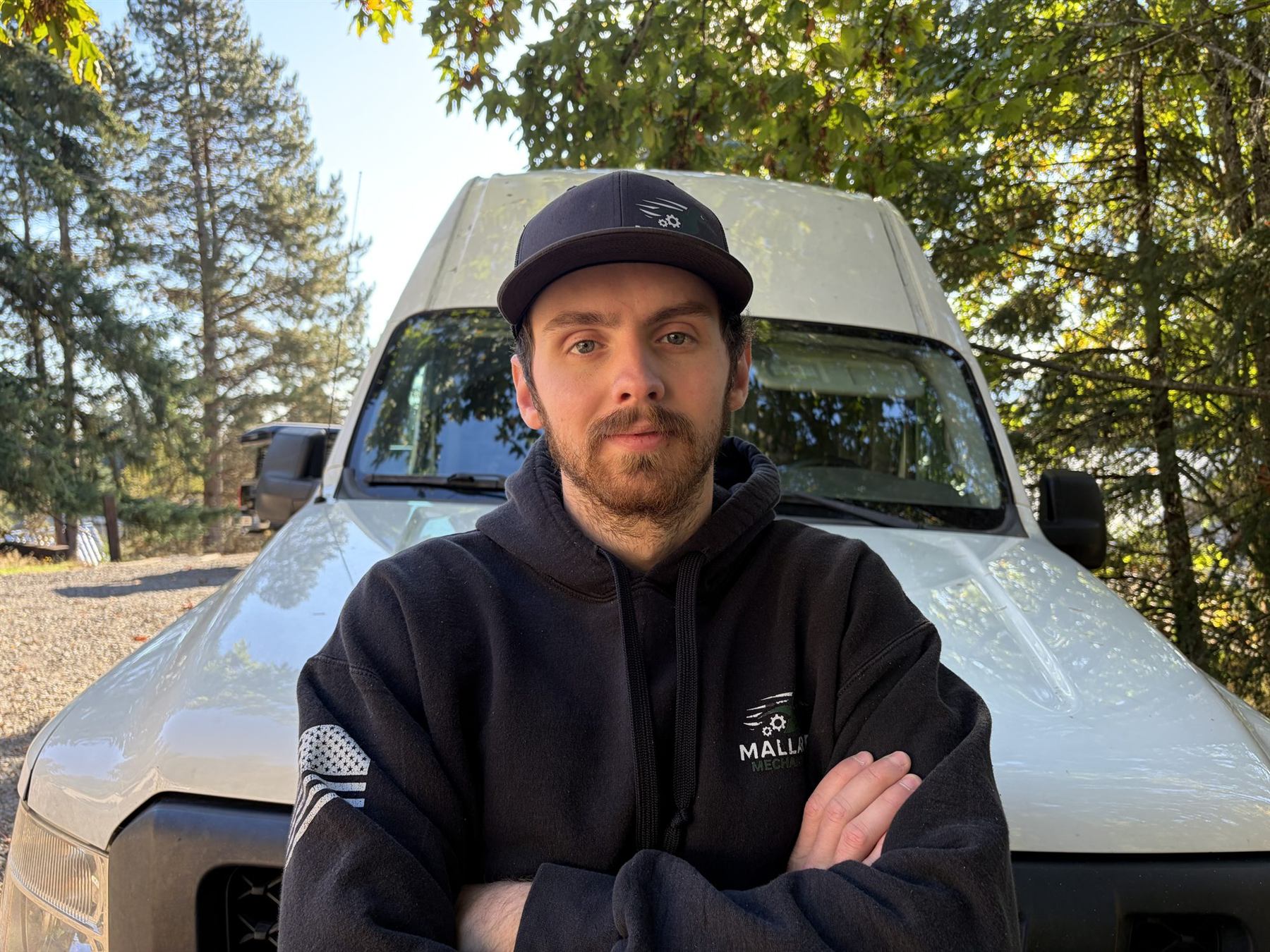 A Mallard Mechanical technician in front of the van