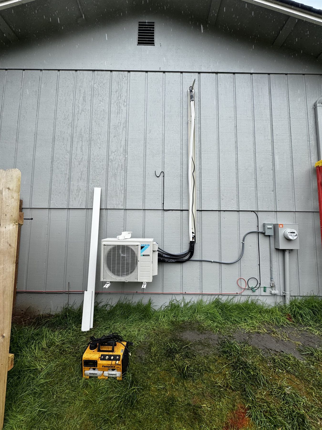 A Daikin outdoor unit on a metal building