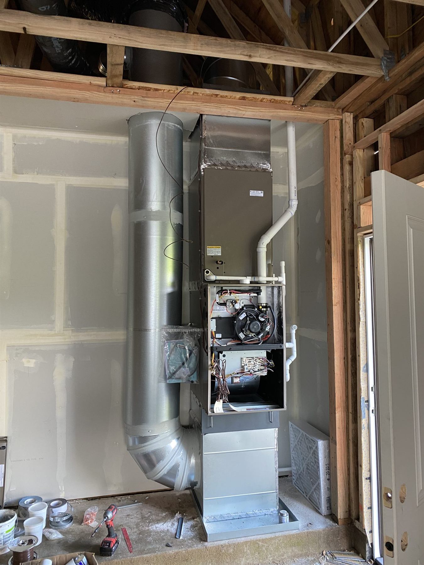 A furnace and ductwork during installation