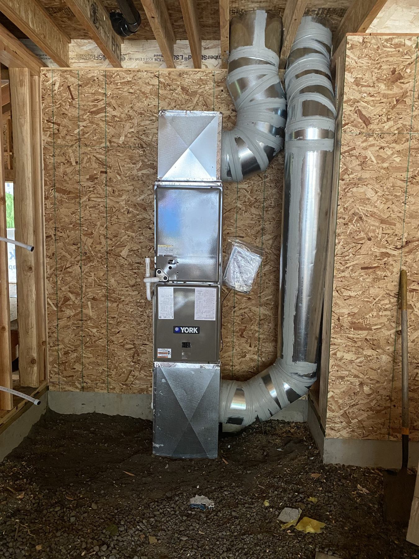 A furnace and ductwork during construction