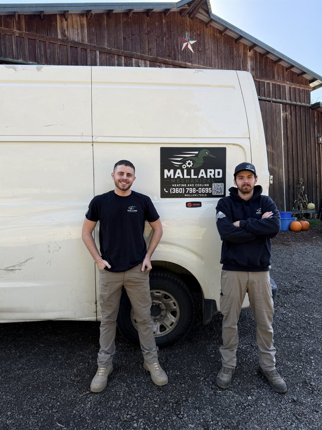 Mallard Mechanical technicians beside the service van